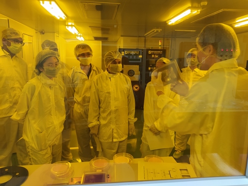 Students having a first-hand experience on the semiconductor production process